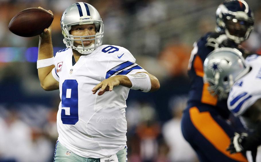 Dallas Cowboys quarterback Tony Romo rolls out to pass against the Denver Broncos during the fourth quarter Sunday in Arlington, Texas. Romo  was 25-for-36 for 506 yards and five touchdowns for Dallas (2-3), breaking Don Meredith’s franchise record of 460 yards. He is the fifth quarterback in NFL history to pass for at least 500 yards and five touchdowns in a game, but his late interception set up Denver's game-winning field goal.