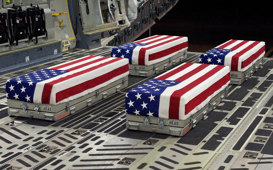 The remains of four soldiers await transfer at Dover Air Force Base, Del., Jan. 8, 2012.