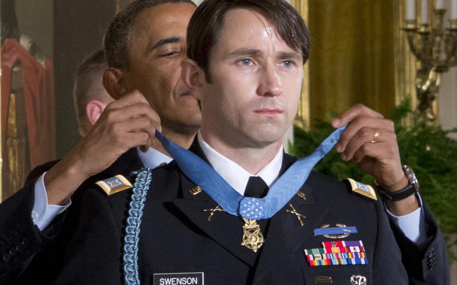 President Barack Obama awards the Medal of Honor to former Army Capt. William Swenson at the White House on Oct. 15, 2013.