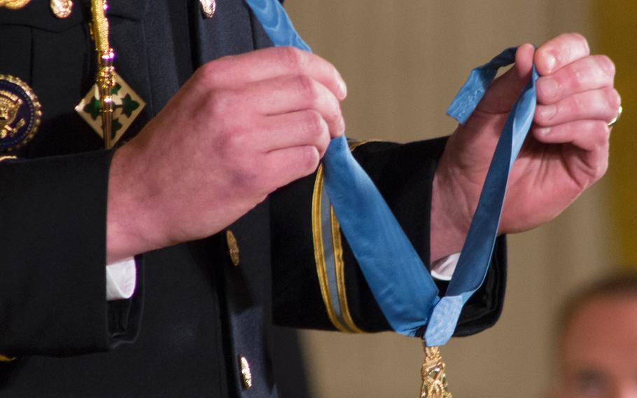 The Medal of Honor about to be placed around Capt. William Swenson's neck. 