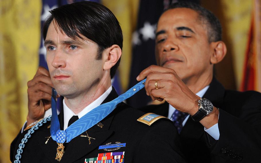 U.S. Army Capt. William Swenson is awarded the Medal of Honor by President Barack Obama on Tuesday, October 15, 2013, at the White House in Washington, DC.