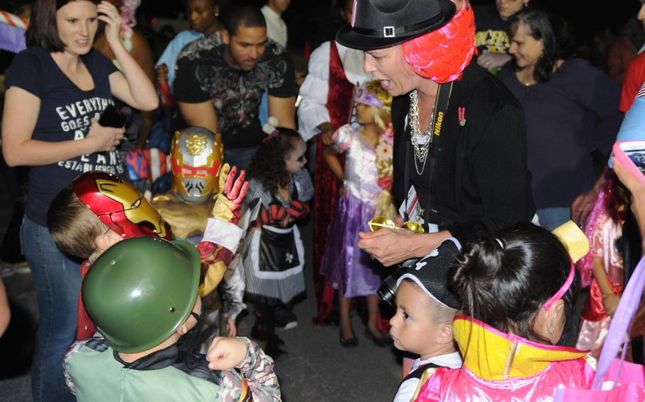 Cheryl Gibson, the brigade commander's wife, judges the costume contest for children ages 0-5 at the Fall Festival at Fort Hood, Texas, on Oct. 26.