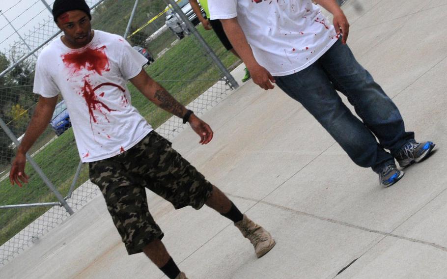 Soldiers from 4-5 ADA practice their zombie walking skills during the unit's zombie run at the Lightning Ranch at Fort Hood, Texas, on Oct. 26.