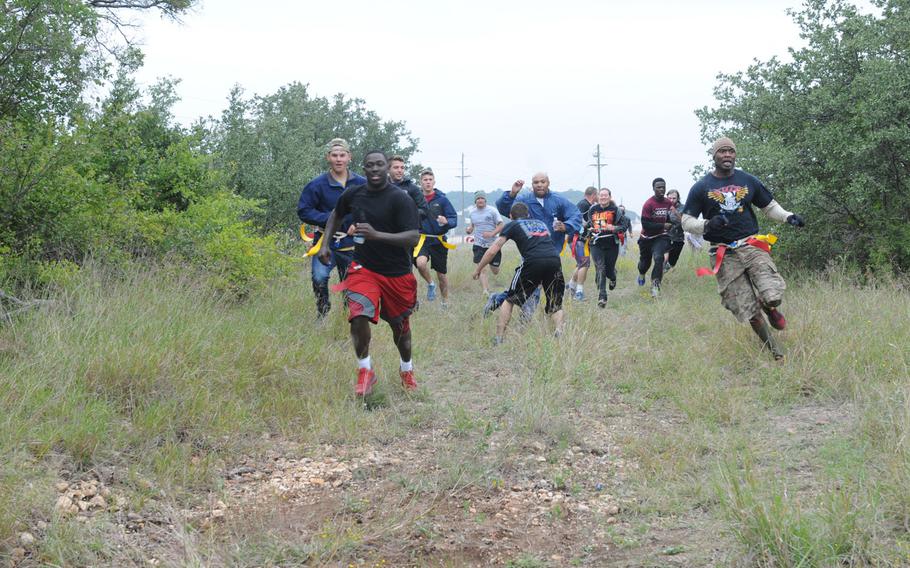 Soldiers and families from the 69th Air Defense Artillery Brigade participate in the zombie run at the Lightning Ranch at Fort Hood, Texas, on Oct. 26.