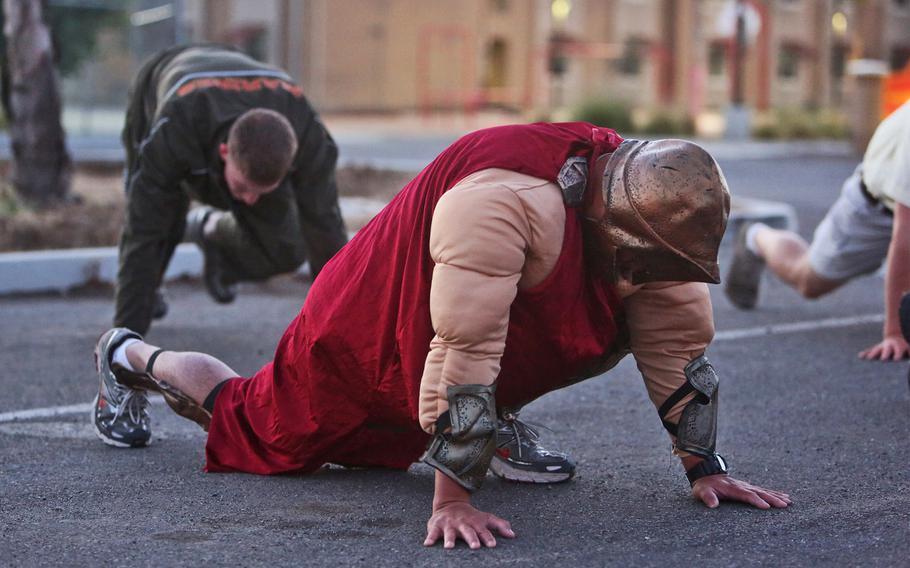 Marines conduct a Halloween-themed, physical training circuit aboard Camp Pendleton, Calif., Oct. 30, 2013. / Released)