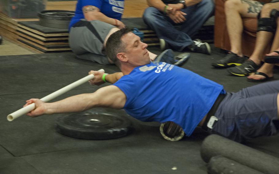 An athlete warms up and stretches during the Working Wounded Games on Saturday, Nov. 2, 2013. 