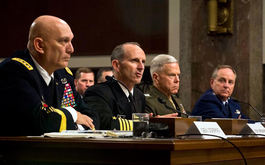 From left, Army Chief of Staff Gen. Raymond Odierno, Chief of Naval Operations Adm. Jonathan Greenert, Marine Corps Commandant Gen. James Amos and Air Force Chief of Staff Gen. Mark Welsh testify on Capitol Hill in Washington, on Thursday, Nov. 7, 2013, before the Senate Armed Services Committee on budget cuts to the military.