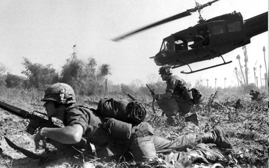 Maj. Bruce Crandall's UH-1D helicopter climbs skyward after discharging a load of infantrymen in Vietnam.