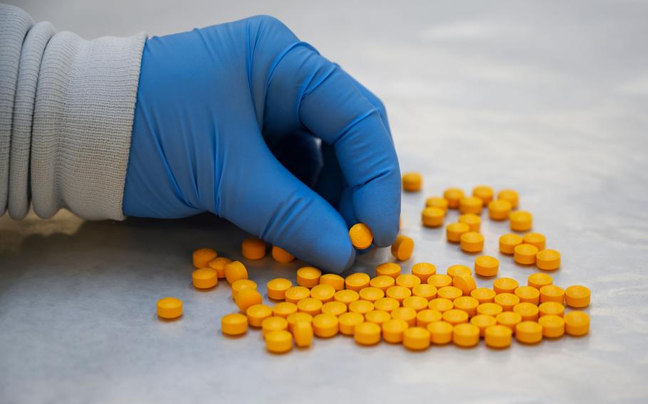 A Drug Enforcement Administration (DEA) chemist checks confiscated powder containing fentanyl at the DEA Northeast Regional Laboratory on Oct. 8, 2019 in New York. A California man and his alleged partner in cybercrime took to the dark web to peddle, among other drugs, thousands of fake oxycodone pills that were laced with fentanyl, according to the U.S. Department of Justice in December, 2022.