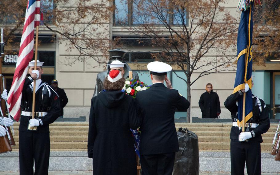 Lou Large helps to lay the wreath at the Lone Sailor during the Pearl Harbor Remembrance Day on Dec. 7, 2013.