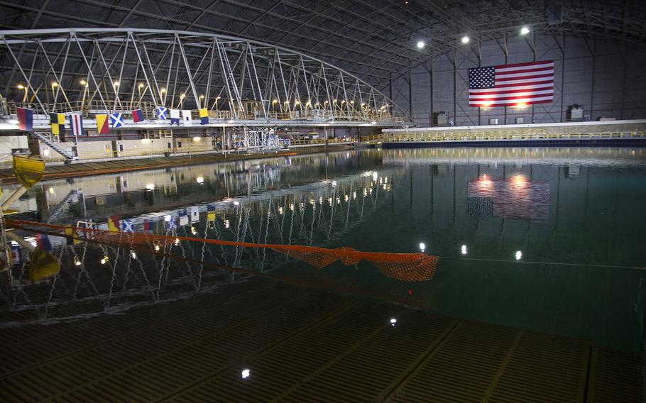 The newly-renovated Maneuvering and Seakeeping Basin at the Naval Surface Warfare 
Center's Carderock Division in Maryland. The tank, used for testing the performance of 
ship models, is larger than a football field at 360 feet by 240 feet, and holds 12 
million gallons of water. It uses 216 individually-controlled wave boards to create precise wave environments that weren't possible with the previous pneumatic system.
Joe Gromelski/Stars and Stripes