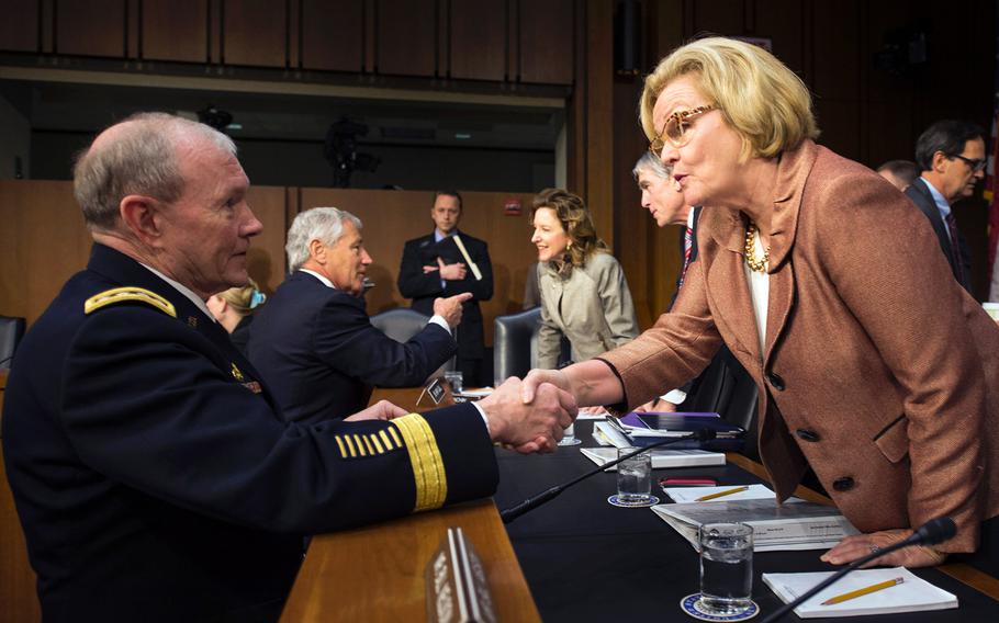 Army Gen. Martin E. Dempsey, Chairman of the Joint Chiefs of Staff, greets U.S. Sen. Claire McCaskill in Washington, D.C., on April 17, 2013. Dempsey and Secretary of Defense Chuck Hagel testified before the Senate Armed Services Committee about the fiscal year 2014 Defense Department budget.