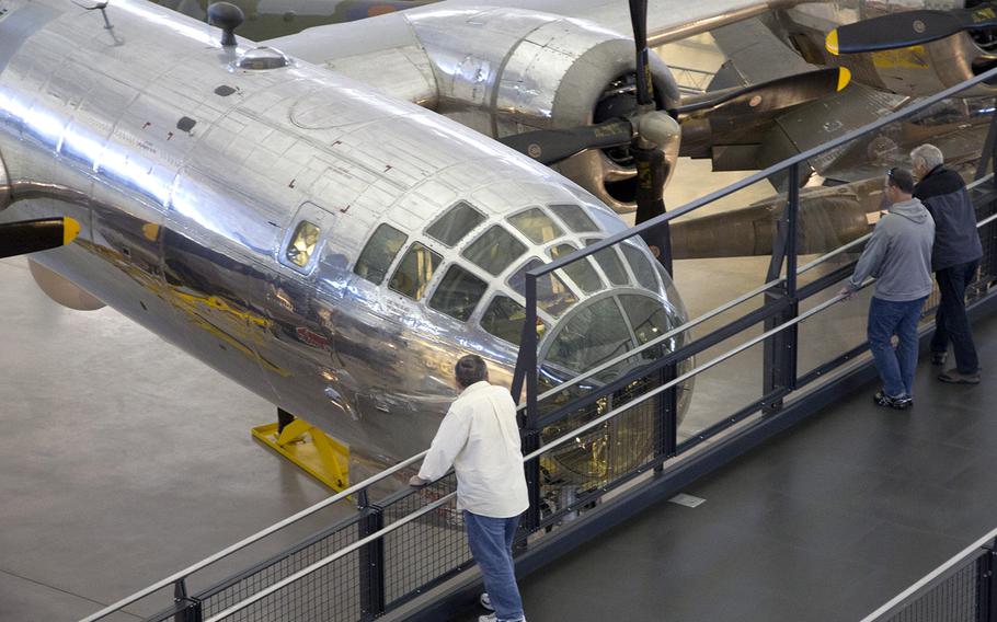 Visitors to the National Air and Space Museum's Steven F. Udvar-Hazy Center in November, 2013 peer into the cockpit of the B-29 Superfortress "Enola Gay."
