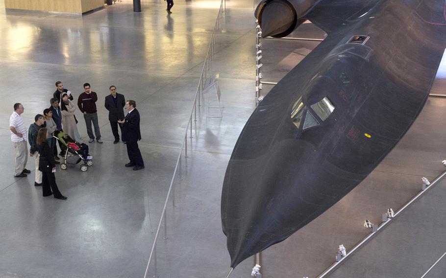 Visitors to the National Air and Space Museum's Steven F. Udvar-Hazy Center hear about the SR-71A Blackbird, the world's fastest jet-propelled aircraft, from a tour guide.This plane flew from Los Angeles to Washington, D.C. in one hour, four minutes and 20 seconds on its last flight in 1990, averaging 2,124 miles per hour.
