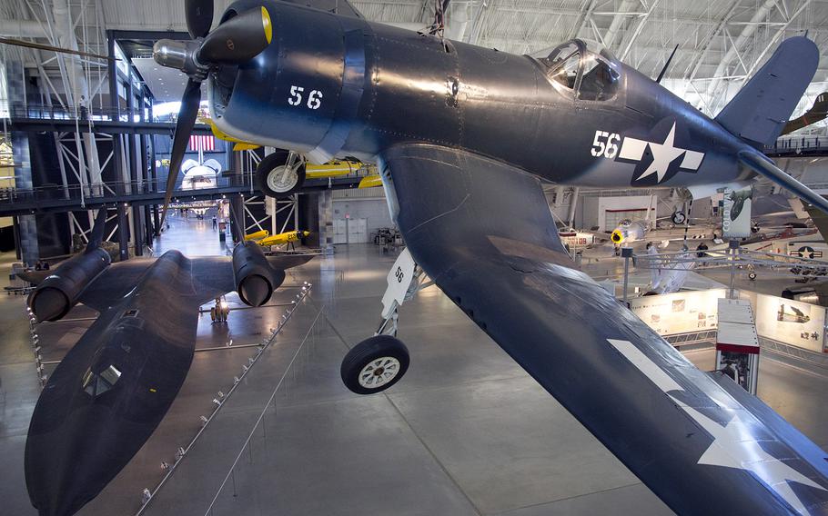 Two generations of aircraft, the Vought F4U-1D Corsair (right) and the SR-71A Blackbird, at the National Air and Space Museum's Steven F. Udvar-Hazy Center, November, 2013.