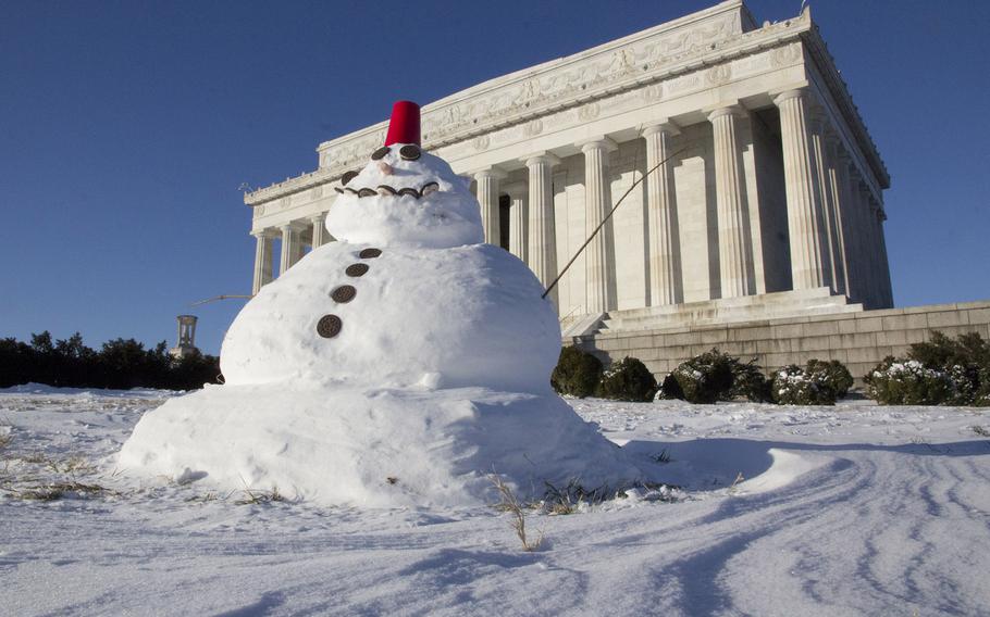 A snowman adorns the lawn in front of the Lincoln Memorial in Washington, D.C. in the wake of Winter Storm Janus on January 22, 2014.