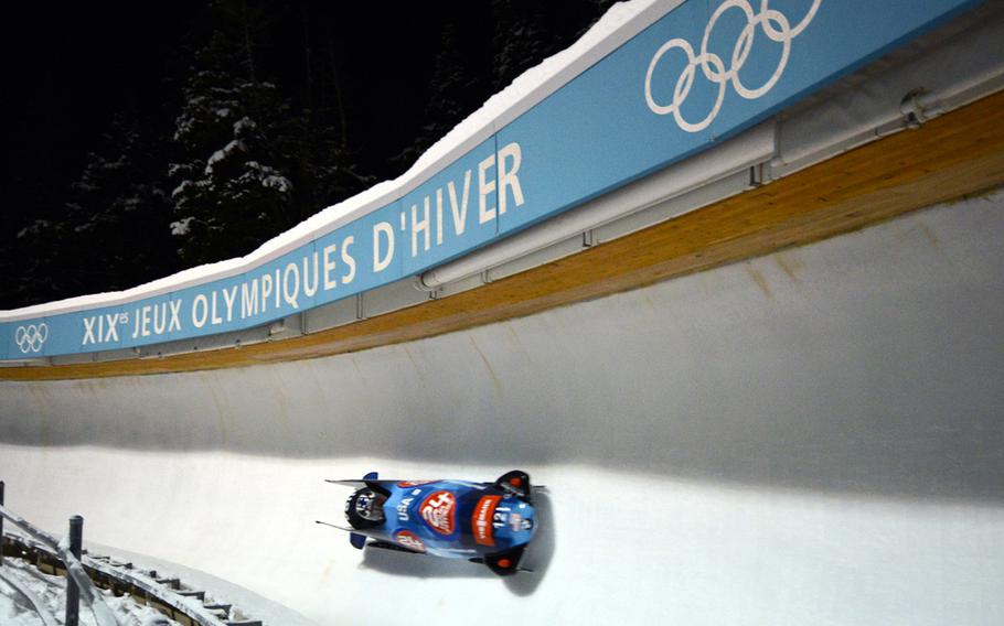 Sgt. Nick Cunningham and Sgt. Dallas Robinson of the U.S. Army World Class Athlete Program speed through Turn 6 en route to a second-place finish in the two-man bobsled at a 2013 World Cup event, Dec. 6, at Utah Olympic Park in Park City.