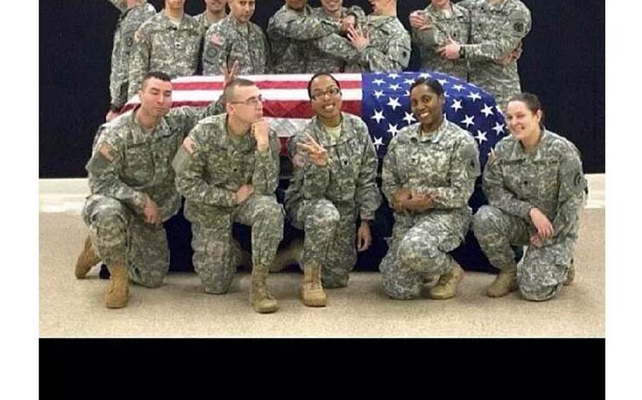 Screenshot of Wisconsin National Guard member Spc. Terry  Harrison's post of soldiers mugging as they stood around a casket draped in a flag.