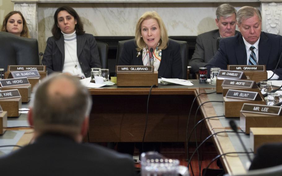 Sen. Kirsten Gillibrand, D-N.Y., quizzes a panel of DOD and VA officials during a hearing on the links between sexual assault and PTSD and suicide, February 26, 2014 on Capitol Hill. At right is Sen. Lindsey Graham, R-S.C.