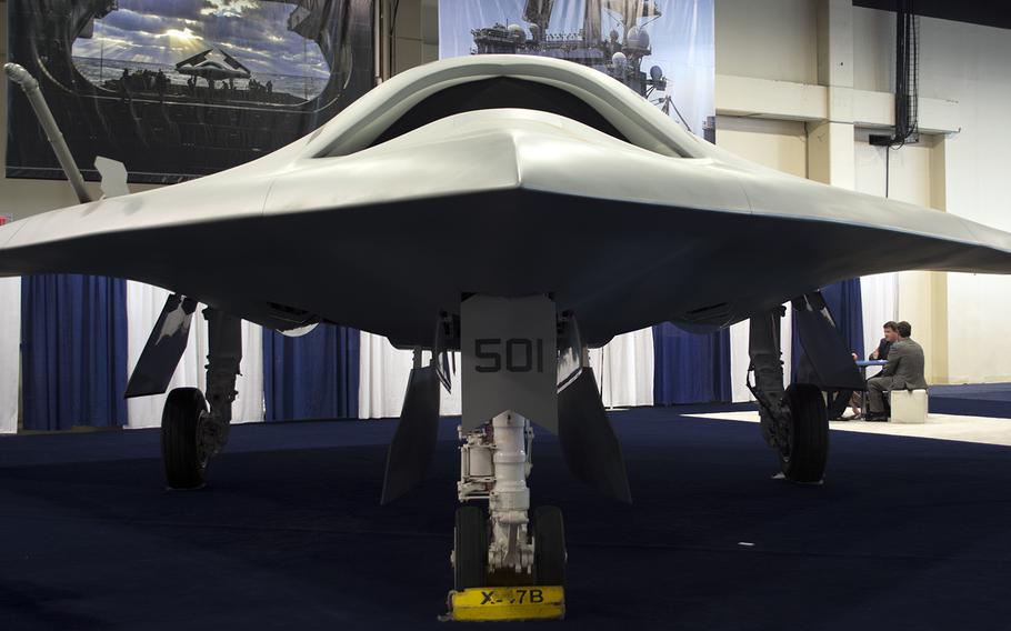 An X-47B drone by Northrop Grumman is on display at the Sea-Air-Space convention in Maryland on April 8, 2014.