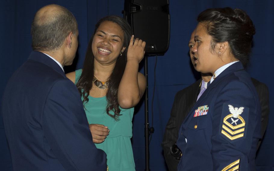 Juanita Lindsay Collins chats with her family after receiving the Military Child of the Year award from Operation Homefront for the Coast Guard service branch. Each service branch was represented. 