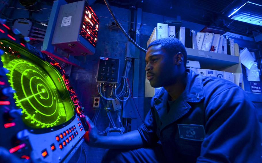 Operations Specialist Seaman Apprentice James Phillips, from Killeen, Texas, monitors the SPA-25G radar aboard the multipurpose amphibious assault ship USS Bataan on April 9, 2014.