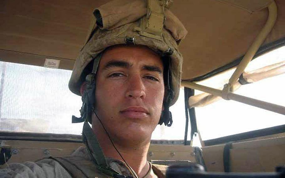 Sgt. Andrew Tahmooressi looks down from his seat in a Marine combat vehicle during one of his combat tours in Afghanistan sometime between 2010 and 2012. Tahmooressi is now in a Tijuana prison on weapons charges. 