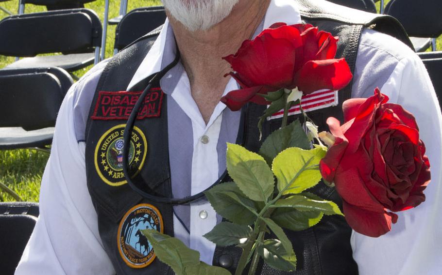 Phillip Davis of Killen, Ala., awaits the start of a ceremony at the Vietnam Veterans Memorial in Washington, D.C. on May 11, 2014 marking the addition of 13 names to the Wall and the change of status of eight others.