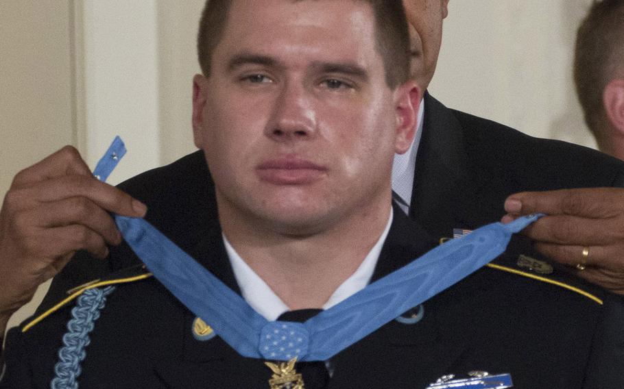 President Barack Obama presents former Army Sgt. Kyle White with the Medal of Honor in a ceremony at the White House on May 13, 2014.