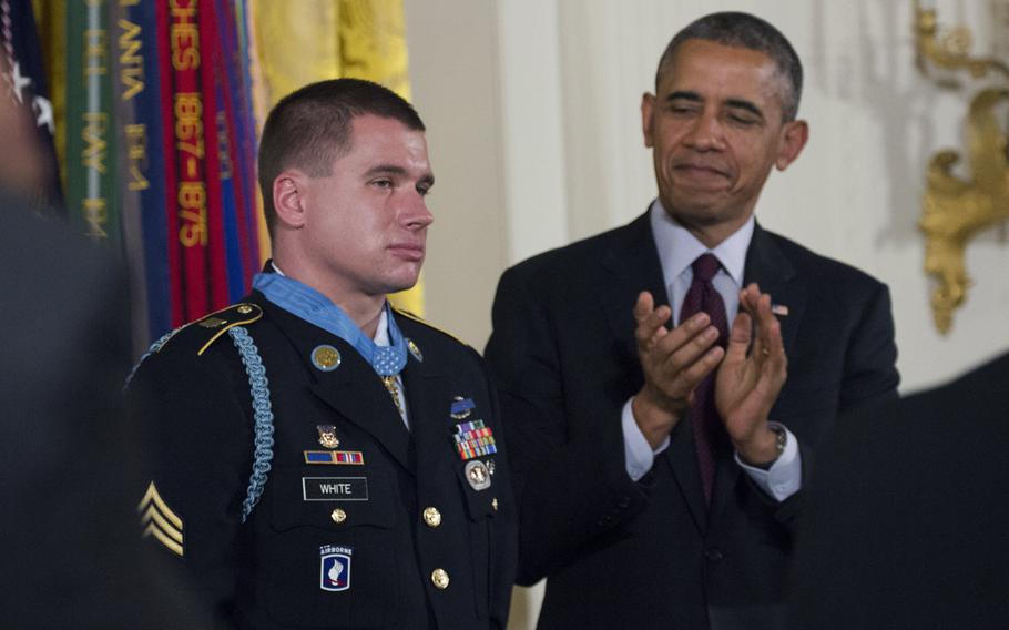 President Barack Obama leads applause for former Army Sgt. Kyle White after presenting him with the Medal of Honor at the White House on May 13, 2014. 