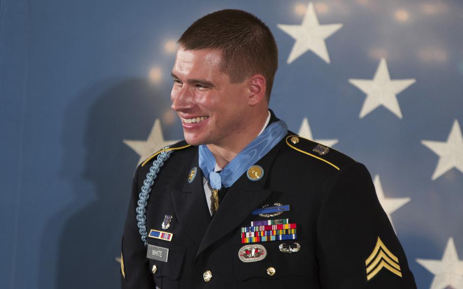 Former Army Sgt. Kyle White smiles after being presented with the Medal of Honor at the White House on May 13, 2014.