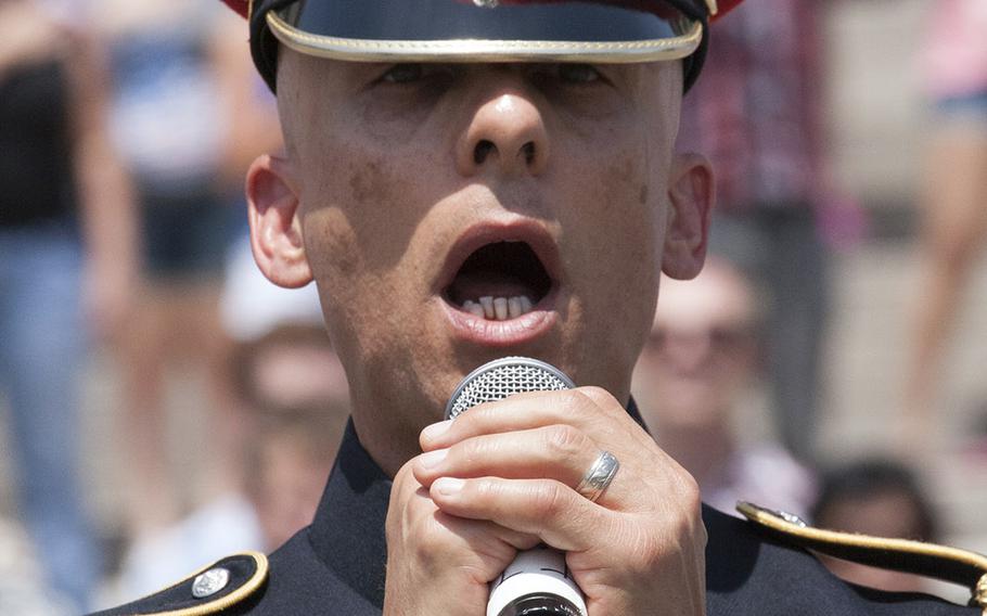 Army Master Sgt. Antonio Giuliano sings the national anthem before the National Memorial Day Parade in Washington, D.C., May 26, 2014.