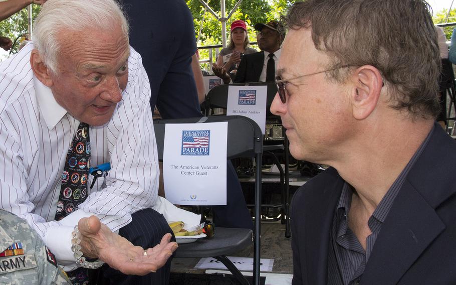 Apollo 11 astronaut Buzz Aldrin talks with actor Gary Sinise before the National Memorial Day Parade in Washington, D.C., May 26, 2014.
