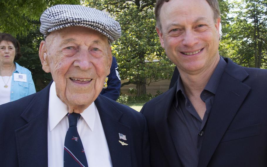 National Memorial Day Parade grand marshal Lt. Col. Richard E. Cole, Jimmy Doolittle's co-pilot on the famous 1942 raid on Tokyo, poses for a photo with actor Gary Sinise in Washington, D.C., May 26, 2014.