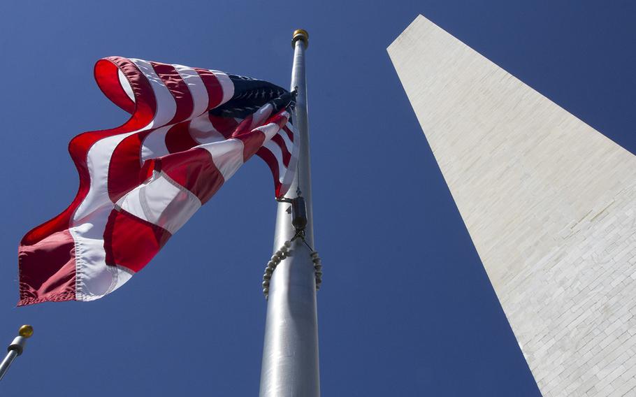 Flags fly half-staff at the newly-reopened Washington Monument on Memorial Day 2014.