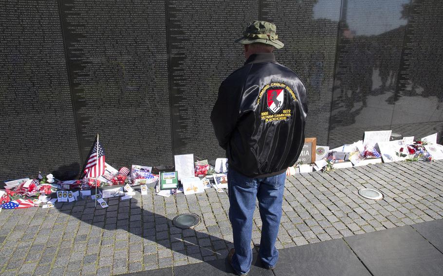 A Vietnam veteran remembers his fallen comrades on Memorial Day 2014 at the Vietnam Veterans Memorial in Washington, D.C.