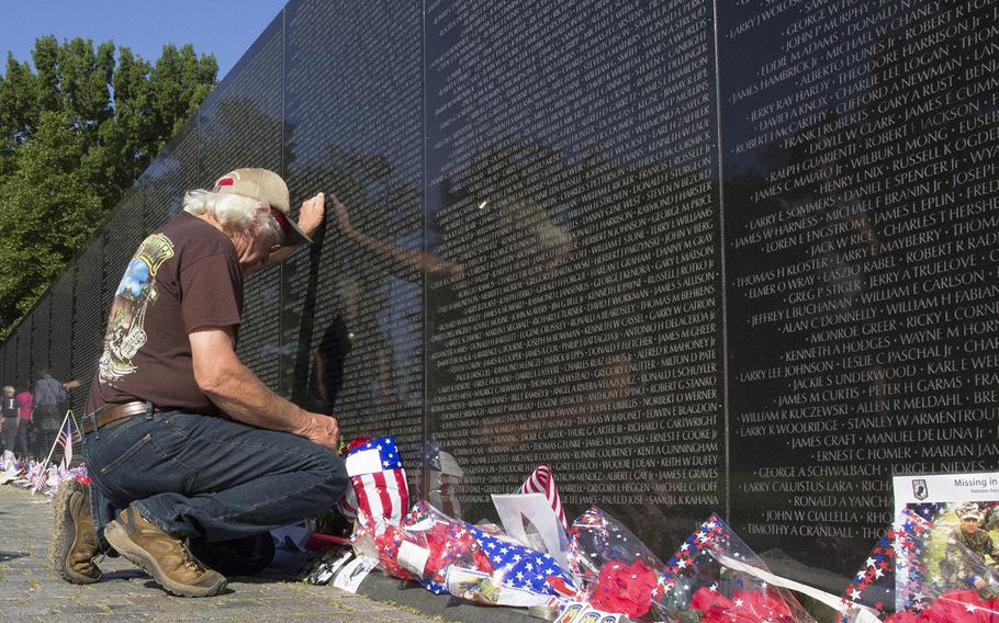 Vietnam veteran Curtis Robertson of Mississippi remembers his fallen comrades during a Memorial Day visit to the Vietnam Veterans Memorial in Washington, D.C., May 26, 2014.
