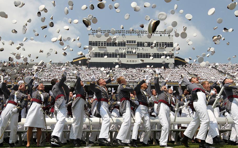 Class of 2012 cadets from the United States Military Academy at West Point, N.Y., toss their hats.