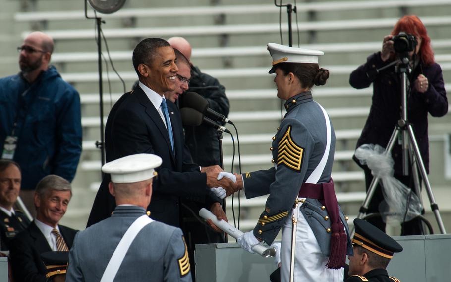 President Barack H. Obama shakes the hand of a graduating West Point Cadet  at Michie Stadium, West Point, N.Y., May 28, 2014. President Obama was addressing the graduating class of 2014 and spoke about his vision for the future.