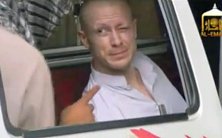 A video screen grab shows Sgt. Bowe Bergdahl sitting in a vehicle guarded by the Taliban in eastern Afghanistan.