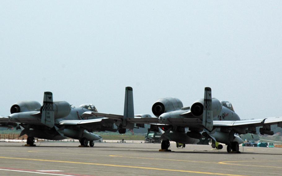 A-10 Thunderbolt IIs wait at Misawa Air Base, Japan in May 2014.