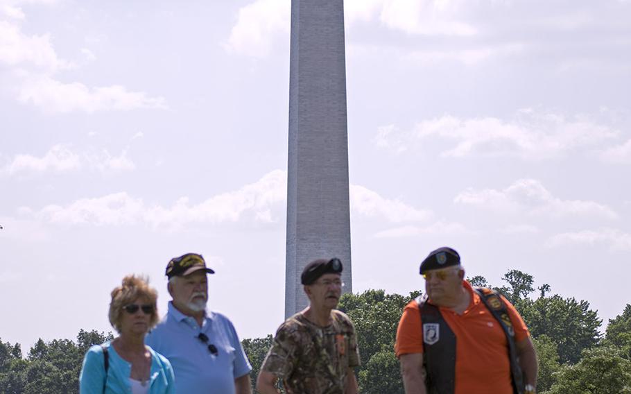 Several Vietnam veterans observe the In Memory Day ceremony at the back of the crowd on Saturday, June 14, 2014.