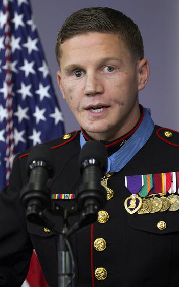 Retired Marine Corps Cpl. Kyle Carpenter speaks to reporters in the White House briefing room after his Medal of Honor ceremony, June 19, 2014.