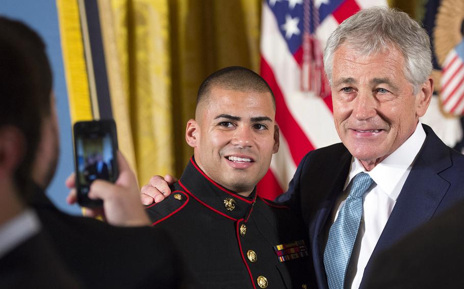 Secretary of Defense Chuck Hagel poses for a photo after the Medal of Honor ceremony for retired Marine Corps Cpl. Kyle Carpenter at the White House, June 19, 2014.
