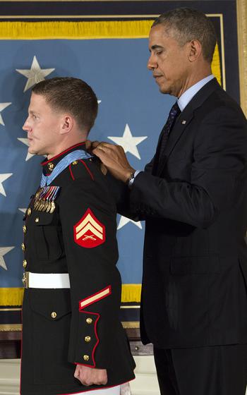 President Barack Obama awards the Medal of Honor to retired Marine Corps Cpl. Kyle Carpenter at the White House, June 19, 2014.