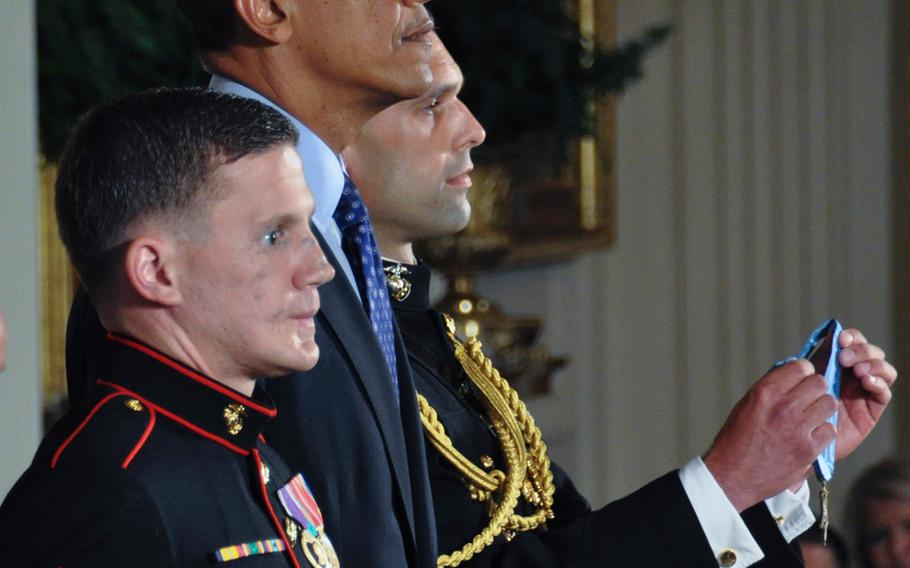 Retired Marine Corps Cpl. Kyle Carpenter, President Barack Obama and military aide Marine Maj. Steven Schreiber listen as Carpenter's Medal of Honor citation is read at the White House, June 19, 2014.