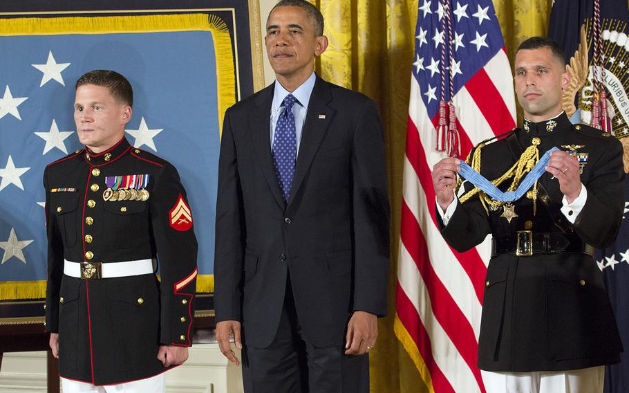 Retired Marine Corps Cpl. Kyle Carpenter, President Barack Obama and military aide Marine Maj. Steven Schreiber listen as Carpenter's Medal of Honor citation is read at the White House, June 19, 2014.