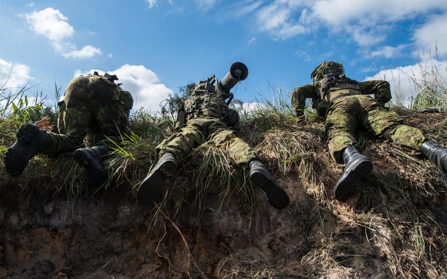 Estonian soldiers from the anti-tank infantry battalion, wait to attack enemy units during a Saber Strike exercise in the Adazi Training Area, Latvia, on June 11, 2014. 
