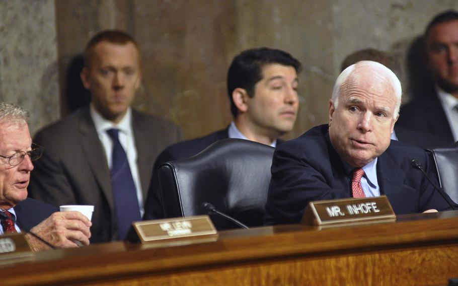 Sen. John McCain, R-Ariz., asks Marine Corps Gen. Joseph F. Dunford, Jr., questions during a hearing on Capitol Hill in Washington on Thursday, July 17, 2014. Members of the Committee on Armed Services were considering Dunford's nomination to be the next Commandant of the Marine Corps.