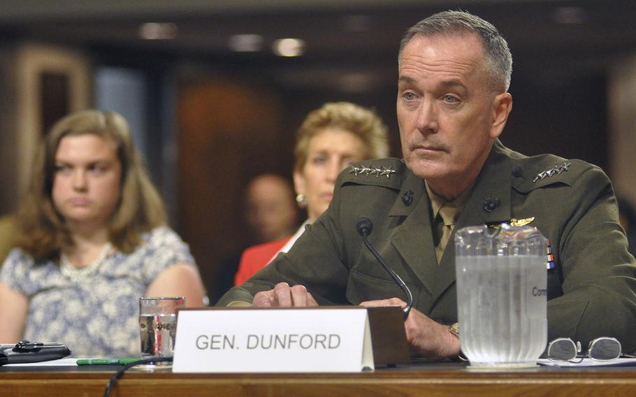 Marine Corps Gen. Joseph F. Dunford, Jr., listens to a question during a U.S. Senate hearing on Capitol Hill in Washington on Thursday, July 17, 2014. Members of the Committee on Armed Services were considering Dunford's nomination to be the next Commandant of the Marine Corps.